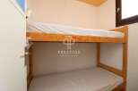 Cozy bunk beds offer a space-saving solution in this charming property.