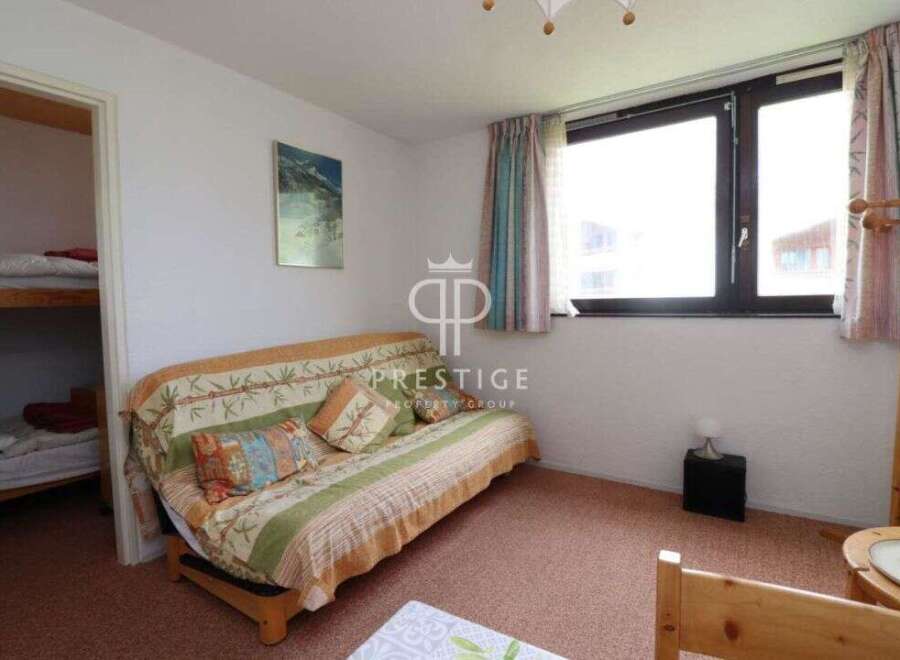 Cozy and inviting, this property features a comfortable sofa perfect for relaxation.