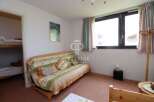 Cozy and inviting, this property features a comfortable sofa perfect for relaxation.