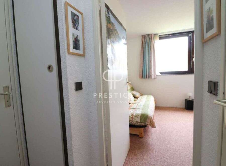 Discover this charming property featuring a cozy bedroom with a comfortable bed and inviting decor.