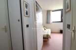 Discover this charming property featuring a cozy bedroom with a comfortable bed and inviting decor.