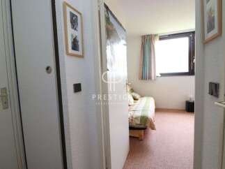 Discover this charming property featuring a cozy bedroom with a comfortable bed and inviting decor.