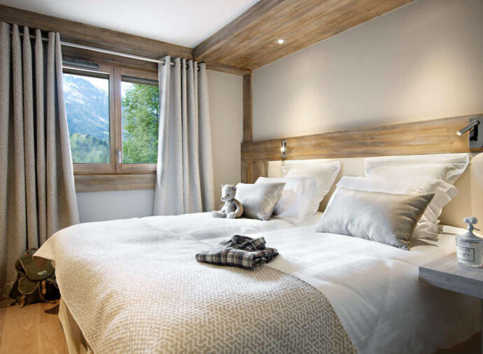 Bedroom with view of the mountains in  Les Houches, France. 