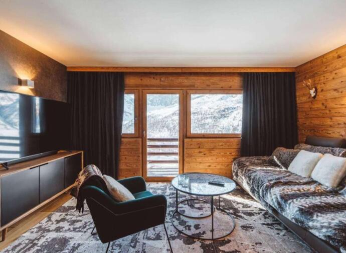 Living room with mountain views in   Pila, Aosta, Italy.