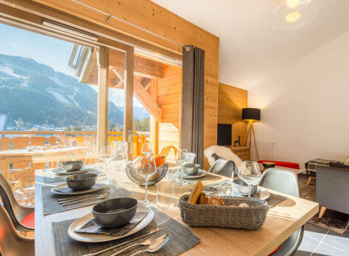 Inside dining area with impressive view of the mountains in Chatel, France.