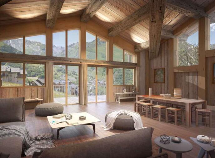 Living area with large windows benefitting from mountain views in St Martin De Belleville, France. 