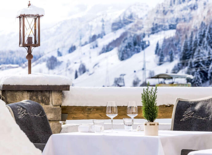 Outside dining area with views of the mountains in St Anton, Tirol.    