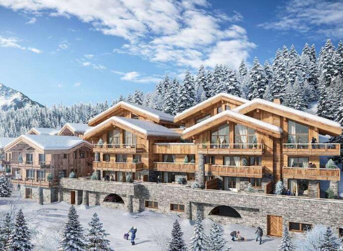 Luxury alpine chalets with wooden exteriors and large balconies, covered in snow, set against a backdrop of snow-capped trees and mountains.