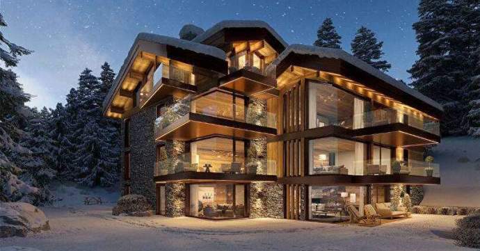 Exterior of a ski property in Courchevel, France at night.