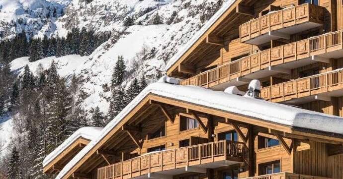 A chalet in Le Grand Bornand compete with pool, parking restaurants and two integrated shops